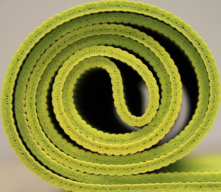 Rolled up yoga mat side on view